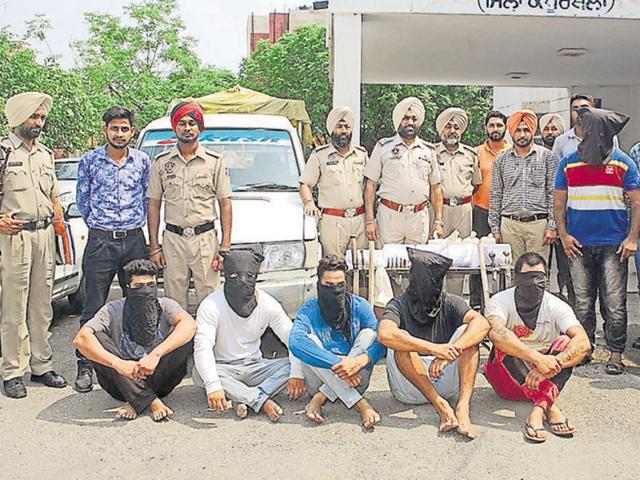 The police have recovered four pistols, a .12-bore rifle, a country-made pistol and 29 live cartridges, besides 1.3kg of heroin, a Toyota Qualis (PB-08-AK-3666) and sharp-edged weapons from their possession. (HT Photo) The police have recovered four pistols, a .12-bore rifle, a country-made pistol and 29 live cartridges, besides 1.3kg of heroin, a Toyota Qualis (PB-08-AK-3666) and sharp-edged weapons from their possession. (HT Photo)