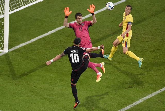 Armando Sadiku (L) heads in the winning goal for Albania. (AFP) Armando Sadiku (L) heads in the winning goal for Albania. (AFP)