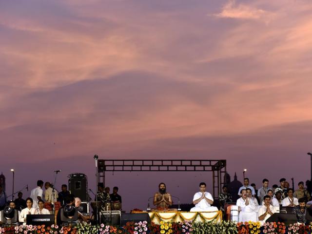 Ramdev and Acharya Balkrishna perform yoga during a rehearsal for the International Yoga Day event at Rajpath. (Virendra singh gosain/HT Photo) Ramdev and Acharya Balkrishna perform yoga during a rehearsal for the International Yoga Day event at Rajpath. (Virendra singh gosain/HT Photo)
