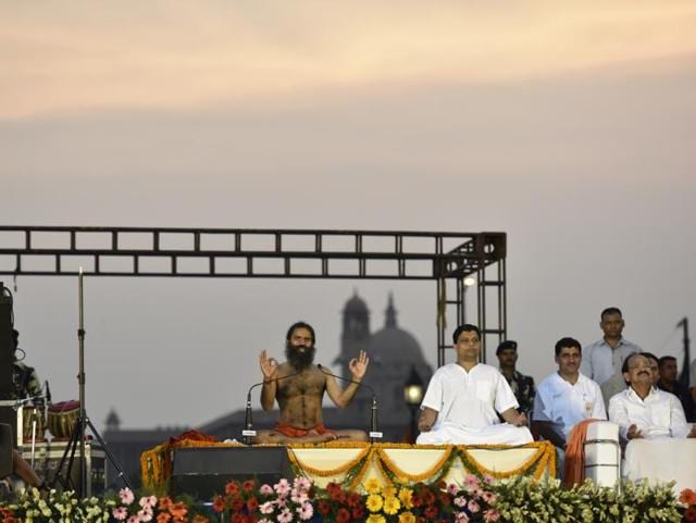 Ramdev, Acharya Balkrishna and Union minister Venkaiah Naidu practice yoga at Rajpath. (Virendra singh gosain/Ht photo) Ramdev, Acharya Balkrishna and Union minister Venkaiah Naidu practice yoga at Rajpath. (Virendra singh gosain/Ht photo)
