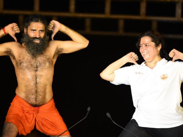 Ramdev teaches yoga to BJP leader Meenakshi Lekhi. (Virendra singh gosain/ht photo) Ramdev teaches yoga to BJP leader Meenakshi Lekhi. (Virendra singh gosain/ht photo)