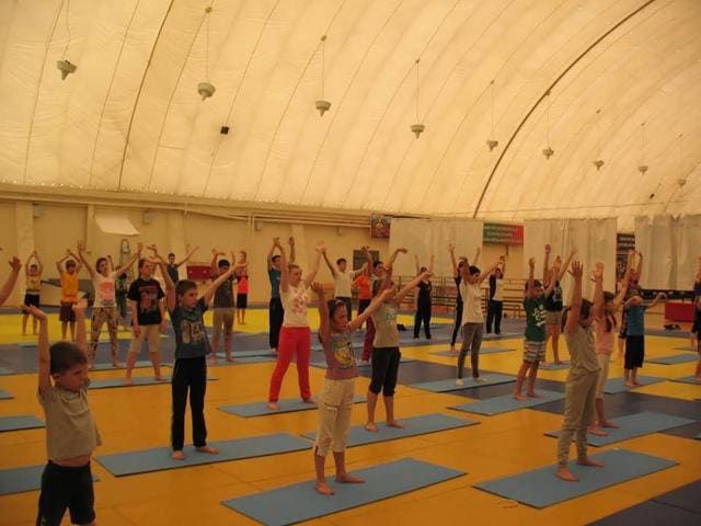 Children perform yoga in Cerkesse, Russia. (Indian embassy in Moscow) Children perform yoga in Cerkesse, Russia. (Indian embassy in Moscow)