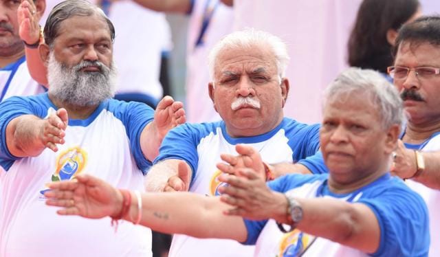 (From Left) Haryana health minister Anil Vij, chief minister Manohar Lal Khattar and Ambala MP Rattan Lal Kataria during the International Yoga Day event at Capitol Complex in Chandigarh on Tuesday. (Sanjeev Sharma/HT Photo)