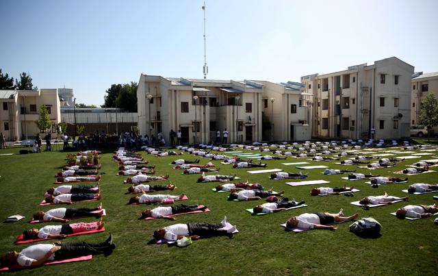 Afghans and foreigners perform yoga to mark International Yoga Day at the Indian Embassy, in Kabul. (AP) Afghans and foreigners perform yoga to mark International Yoga Day at the Indian Embassy, in Kabul. (AP)
