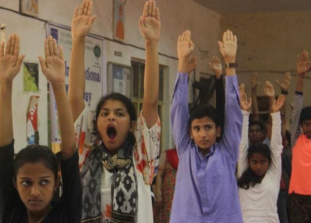 The early start to the day got to some of the students during a yoga session at RD National College,Bandra. (pramod thakur)
