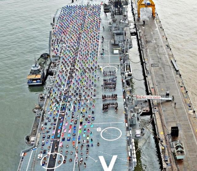 Indian Naval Cadets participate in a mass yoga demonstration on the deck of INS Viraat . (defence pro)