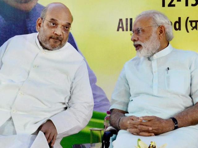 Prime Minister Narendra Modi interacts with BJP's national president Amit Shah during the party's national executive meet in Allahabad. (PTI) Prime Minister Narendra Modi interacts with BJP's national president Amit Shah during the party's national executive meet in Allahabad. (PTI)