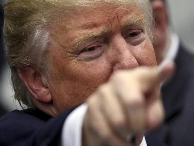 US Republican presidential candidate Donald Trump points to a supporter as he leaves a campaign event in an airplane hanger in Rome, New York. (Reuters) US Republican presidential candidate Donald Trump points to a supporter as he leaves a campaign event in an airplane hanger in Rome, New York. (Reuters)