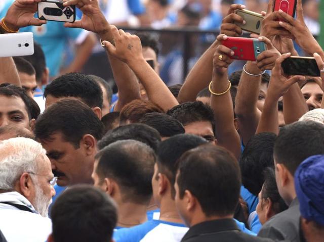 PM Narendra Modi is the target of phone cameras as he leaves the venue of the second International Day of Yoga, at Capitol Complex, Chandigarh, on Tuesday. (Sanjeev Sharma/HT Photo) 