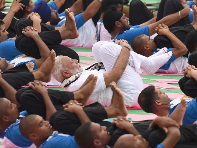 PM Narendra Modi performing at the second International Day of Yoga, at Capitol Complex, Chandigarh, on Tuesday. (Sanjeev Sharma/HT Photo) 