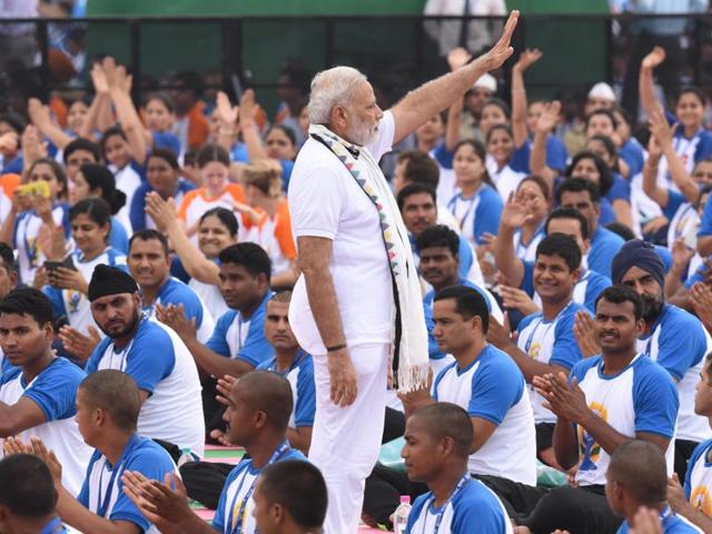 PM Narendra Modi waving to people before performing yoga at the second International Day of Yoga, at Capitol Complex, Chandigarh, on Tuesday. (Sanjeev Sharma/HT Photo) 