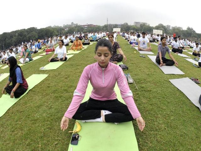 People perform yoga at Punjab University Chandigarh. (Ravi Kumar/HT Photo) People perform yoga at Punjab University Chandigarh. (Ravi Kumar/HT Photo)