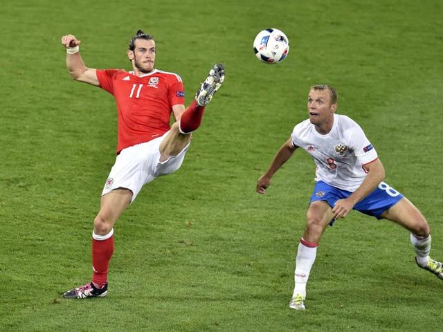 Wales' forward Gareth Bale (L) vies for the ball against Russia's midfielder Denis Glushakov during the Euro 2016 group B football match between Russia and Wales. (AFP Photo) Wales' forward Gareth Bale (L) vies for the ball against Russia's midfielder Denis Glushakov during the Euro 2016 group B football match between Russia and Wales. (AFP Photo)