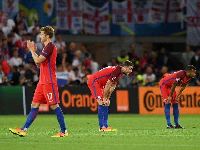 England's midfielders Eric Dier (left), Jordan Henderson and defender Ryan Bertrand react following their 0-0 draw during the Euro 2016 group B football match between Slovakia and England at the Geoffroy-Guichard stadium in Saint-Etienne. (AFP Photo)