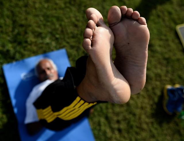 A Malaysian practitioners perform yoga exercises at Sultan Abdul Samad building in Kuala Lumpur. (AFP) A Malaysian practitioners perform yoga exercises at Sultan Abdul Samad building in Kuala Lumpur. (AFP)