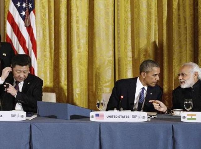 Chinese President Xi Jinping, US President Barack Obama and Prime Minister Narendra Modi attend a working dinner in the East Room of the White House. (AFP) Chinese President Xi Jinping, US President Barack Obama and Prime Minister Narendra Modi attend a working dinner in the East Room of the White House. (AFP)