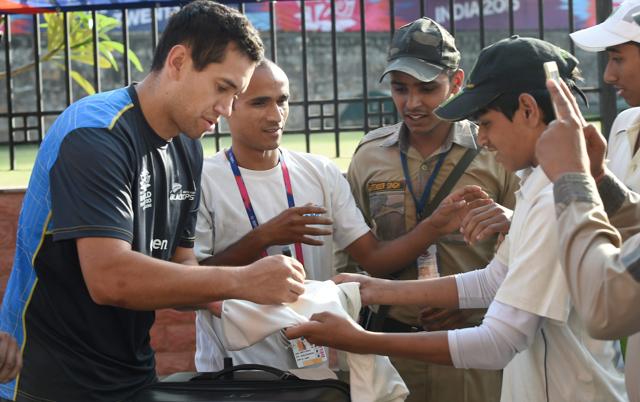 Ross Taylor signing autographs during a practice session at the Ferozshah Kotla in New Delhi on Tuesday, ahead of their WT20 semi-final match against England. (PTI)