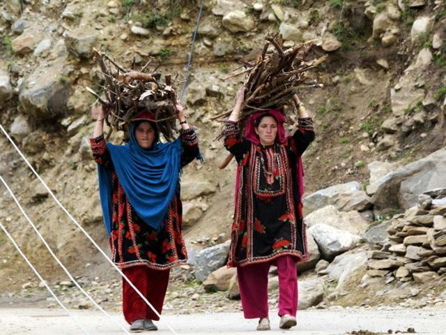 File photo shows Pakistani women carrying firewood on their heads as they walk in a village near Sharda in the mountainous region of Neelum Valley. (AFP) File photo shows Pakistani women carrying firewood on their heads as they walk in a village near Sharda in the mountainous region of Neelum Valley. (AFP)