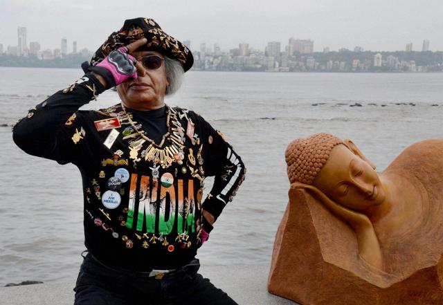 A participant performs yoga at Marine Drive in south Mumbai on Tuesday. (PTI) A participant performs yoga at Marine Drive in south Mumbai on Tuesday. (PTI)