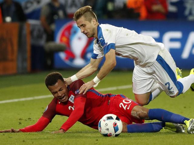 Slovakia's Peter Pekarik falls on top of England's Dele Alli during the Euro 2016 Group B football match between Slovakia and England. (AP Photo)