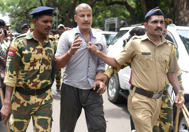 Police arrest taxi driver who was part of a rally organised at Azad Maidan. (PTI) Police arrest taxi driver who was part of a rally organised at Azad Maidan. (PTI)