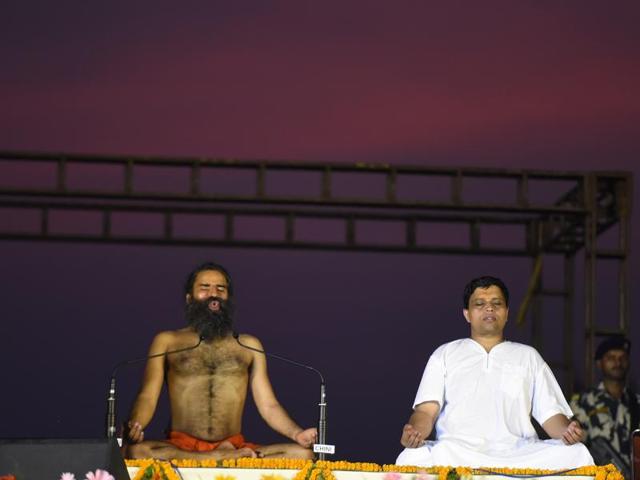 Baba Ramdev and Acharya Balkrishna perform Yoga during the rehearsals for the upcoming International Yoga Day at Rajpath, in New Delhi, India on Sunday, June 19, 2016. (Sonu Mehta / HT Photo) Baba Ramdev and Acharya Balkrishna perform Yoga during the rehearsals for the upcoming International Yoga Day at Rajpath, in New Delhi, India on Sunday, June 19, 2016. (Sonu Mehta / HT Photo)