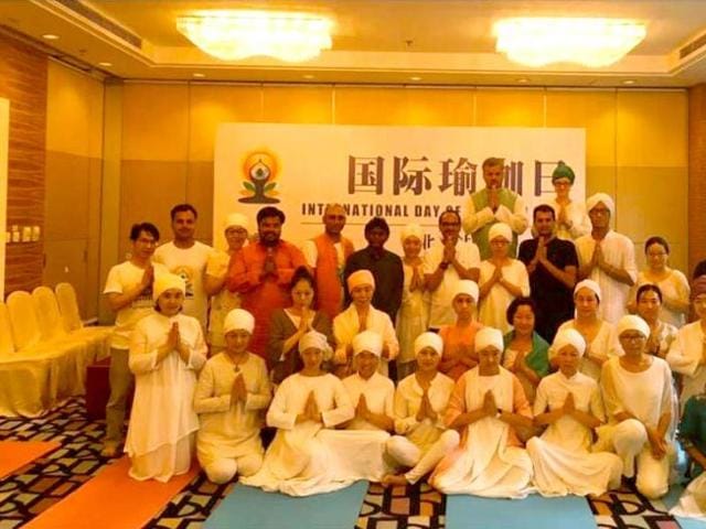 Chief minister Shivraj Singh Chouhan performs yoga on International Yoga Day, in Beijing on Tuesday.