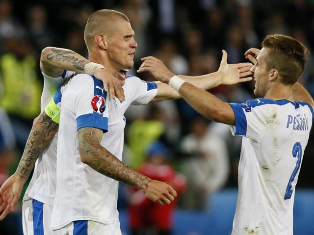 Slovakia's Martin Skrtel and Peter Pekarik at the end of their game against England, at Stade Geoffroy-Guichard, Saint-Étienne, France. (Reuters Photo)