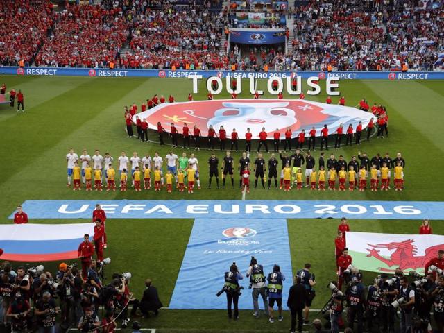 Teams stand during the playing of the national anthems during the Euro 2016 Group B football match between Russia and Wales at the Stadium municipal in Toulouse, France. (AP Photo)