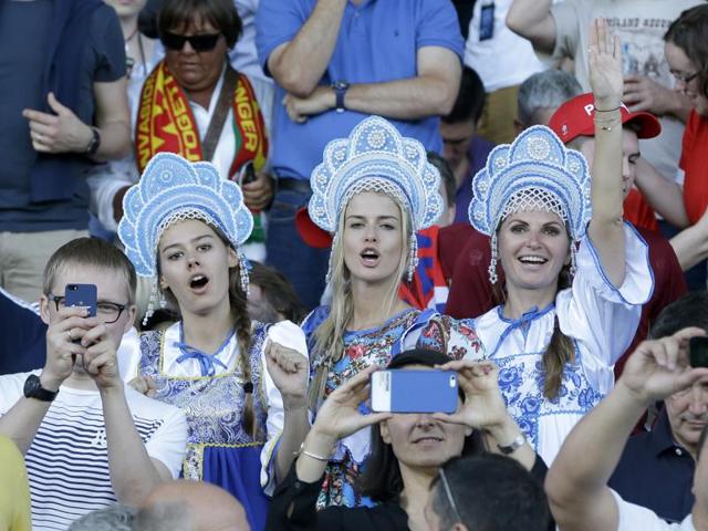 Russian fans wearing traditional outfits cheer from the stands before the Euro 2016 Group B football match between Russia and Wales at the Stadium municipal in Toulouse, France. (AP Photo)