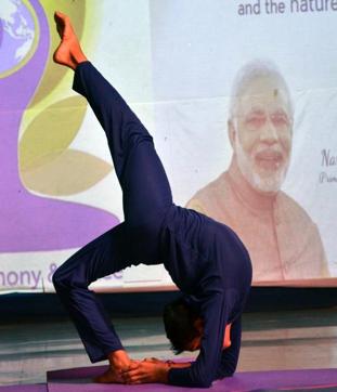 A student strikes a yoga pose at Arya Gurukul School in Kalyan. (Rishikesh Choudhary)
