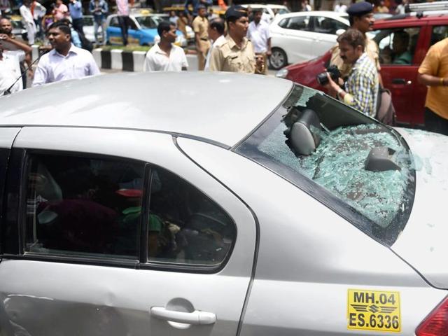 Taxi drivers who were protesting against Uber and Ola taxi operators vandalised a tourist car in Mumbai on Tuesday. (PTI) Taxi drivers who were protesting against Uber and Ola taxi operators vandalised a tourist car in Mumbai on Tuesday. (PTI)