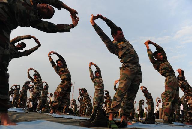 Indian Army soldiers participate in a yoga demonstration in Chennai. (AFP) Indian Army soldiers participate in a yoga demonstration in Chennai. (AFP)