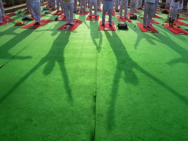 People participate in a mass yoga session to mark the 2nd International Yoga Day, in New Delhi. (Raj K Raj/HT Photo) People participate in a mass yoga session to mark the 2nd International Yoga Day, in New Delhi. (Raj K Raj/HT Photo)