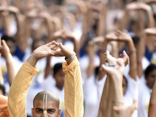 People perform a mass yoga session to mark the second International Yoga Day in New Delhi. (Raj K Raj /HT Photo) People perform a mass yoga session to mark the second International Yoga Day in New Delhi. (Raj K Raj /HT Photo)