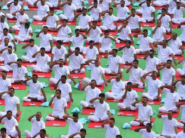 People perform yoga during a mass demonstration in Delhi. (Raj K Raj /HT Photo) People perform yoga during a mass demonstration in Delhi. (Raj K Raj /HT Photo)