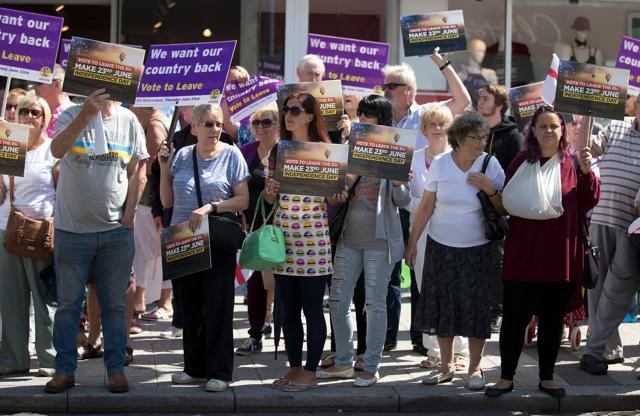 Leave supporters hold up placards in Clacton-on-Sea as UK Independence Party (UKIP) leader Nigel Farage visits. (AFP) Leave supporters hold up placards in Clacton-on-Sea as UK Independence Party (UKIP) leader Nigel Farage visits. (AFP)