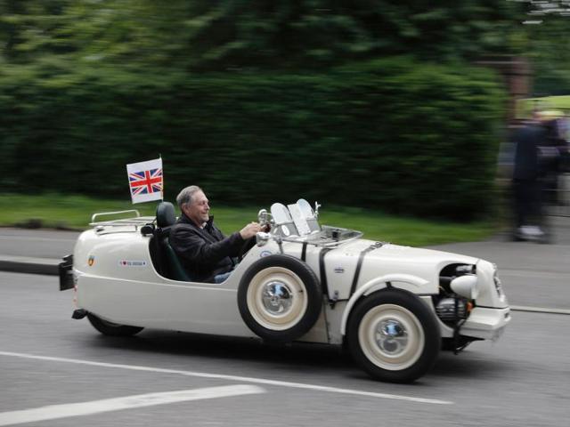 With the vote too close to call, both the Remain and Leave campaigns continued full-steam till the last possible minute, hoping to win the race. A Remain supporter zooms ahead in his three-wheel car at a rally two days ago.  (AFP/Adrian Dennis) 