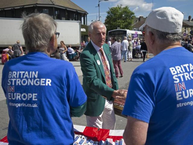 But the Brits sure know how to keep it civil even when they find themselves on the opposite sides of a heated debate.  Remain campaigners shake hands with a Leave supporter in Clacton-on-Sea ahead of a public rally.   (AFP/Justin Tallis) 