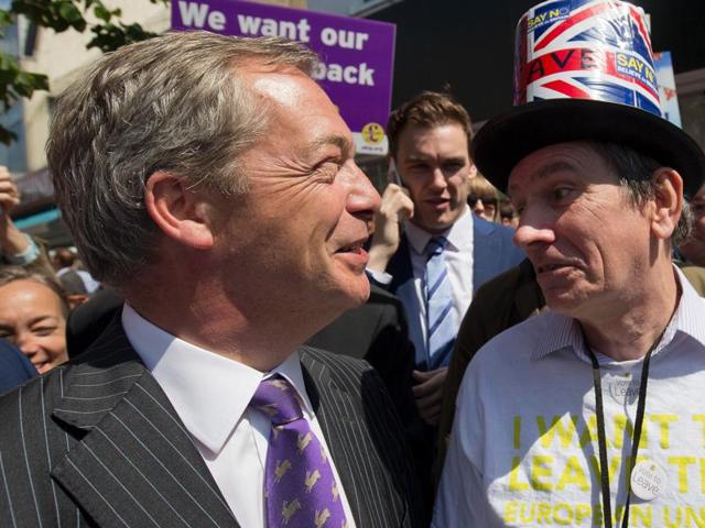 A Leave supporter poses in Clacton-on-Sea with Nigel Farage.  While Farage insists that  Britain will vote for Brexit, he has also hinted at the possibility of a second referendum if they lose by a small margin.  (AFP/Justin Tallis) 