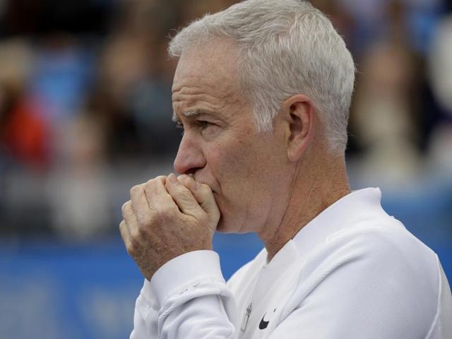 Coach to Canada's Milos Raconic, John McEnroe looks across the court during a tennis match on the sixth day of the Queen's Championships London, England. (AP Photo) Coach to Canada's Milos Raconic, John McEnroe looks across the court during a tennis match on the sixth day of the Queen's Championships London, England. (AP Photo)
