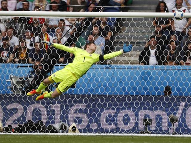 Northern Ireland's goalkeeper Michael McGovern dives to try and make a save. (AFP)