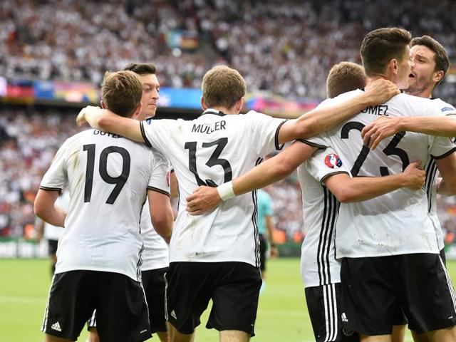 Germany's forward Mario Gomez (2nd R) celebrates scoring the opening goal with teammates during the Euro 2016 group C match against Northern Ireland at the Parc des Princes stadium in Paris on June 21, 2016. Germany won 1-0. (AFP)