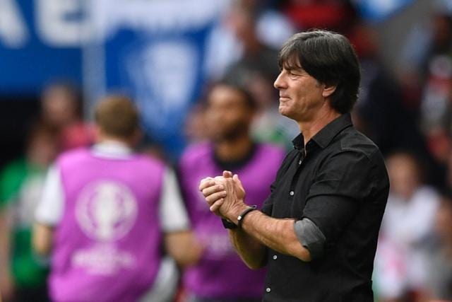 Germany's coach Joachim Loew reacts after Gomez (not pictured) scored the opening goal against Northern Ireland. (AFP Photo)