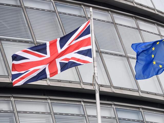 This file photo shows The British Union flag (L) and the European Union (EU) flag flying side-by-side outside City Hall, the headquarters of the Greater London Authority, in central London.(AFP)