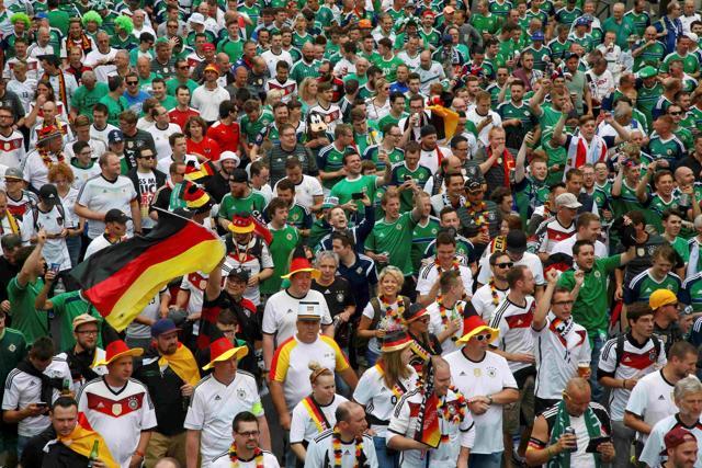 German and Northern Ireland supporters attend a "fan walk" to go to the Parc des Princes stadium. (Reuters Photo)
