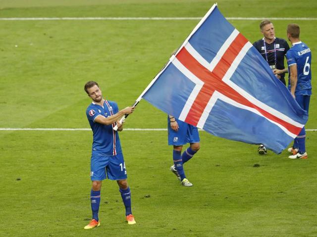 Iceland's Arnor Ingvi Traustason, right, celebrates scoring the winner.(REUTERS)