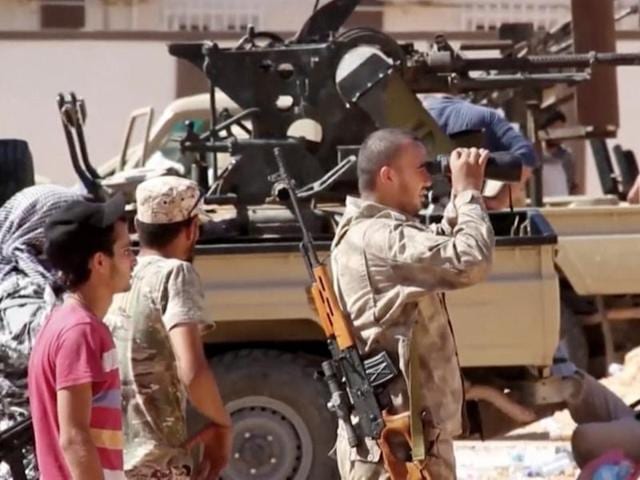 This file photo made from an Associated Press video shows fighters loyal to the unity government on the main street of Sirte. (AP) This file photo made from an Associated Press video shows fighters loyal to the unity government on the main street of Sirte. (AP)