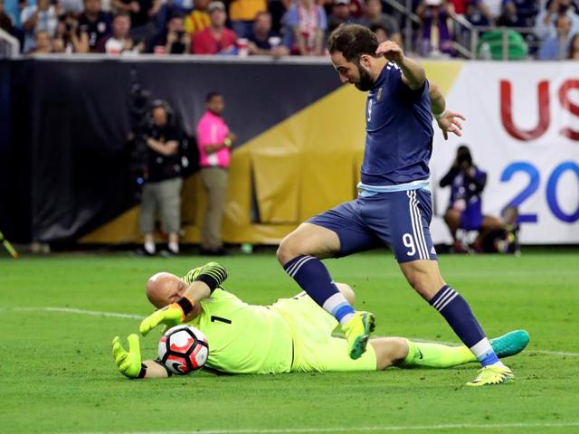 Argentina forward Gonzalo Higuain (9) scores a goal past United States goalkeeper Brad Guzan (1) in the semifinals of the 2016 Copa America Centenario football tournament at NRG Stadium. (Reuters Photo) Argentina forward Gonzalo Higuain (9) scores a goal past United States goalkeeper Brad Guzan (1) in the semifinals of the 2016 Copa America Centenario football tournament at NRG Stadium. (Reuters Photo)