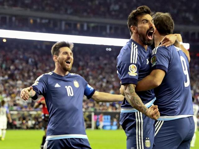 Argentina’s Gonzalo Higuain (right) celebrates with forward Ezequiel Lavezzi (middle) and midfielder Lionel Messi (10) after scoring a goal during the second half of the Copa America clash against the US. (Reuters via USA Today Sports) Argentina’s Gonzalo Higuain (right) celebrates with forward Ezequiel Lavezzi (middle) and midfielder Lionel Messi (10) after scoring a goal during the second half of the Copa America clash against the US. (Reuters via USA Today Sports)